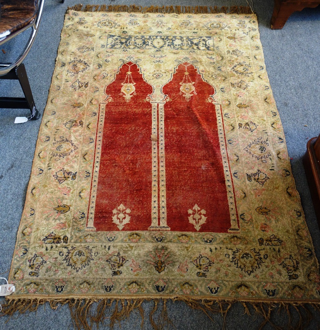 Appraisal: A Turkish silk rug the twin madder mehrab with two