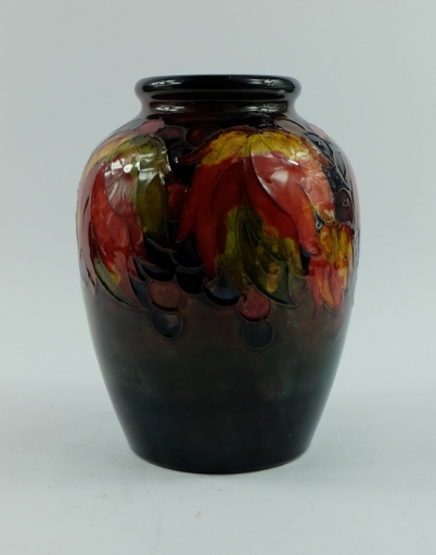 Appraisal: William Moorcroft flambe vase decorated in the leaf and berries