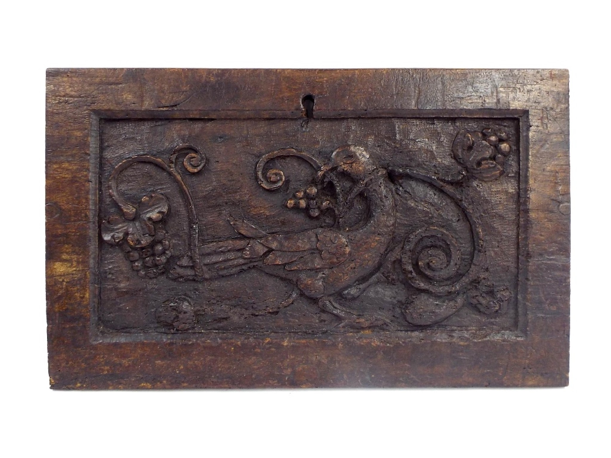 Appraisal: Flemish th century chestnut panel centrally carved with a bird