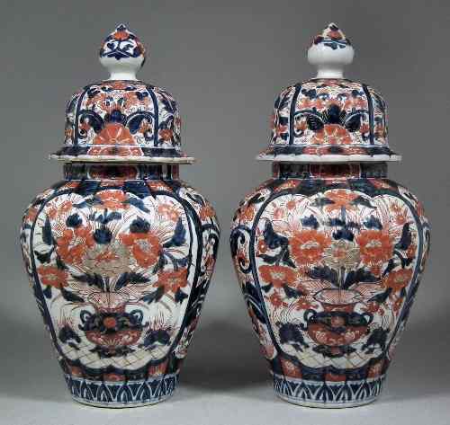 Appraisal: A pair of Japanese porcelain ''Imari'' pattern ribbed baluster shaped