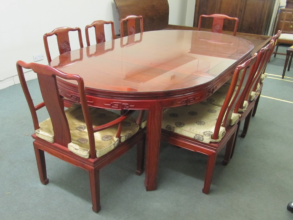 Appraisal: Chinese hardwood dining table with eight chairs