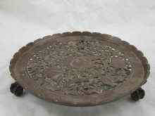 Appraisal: A cast bronze salver on three claw feet the pierced