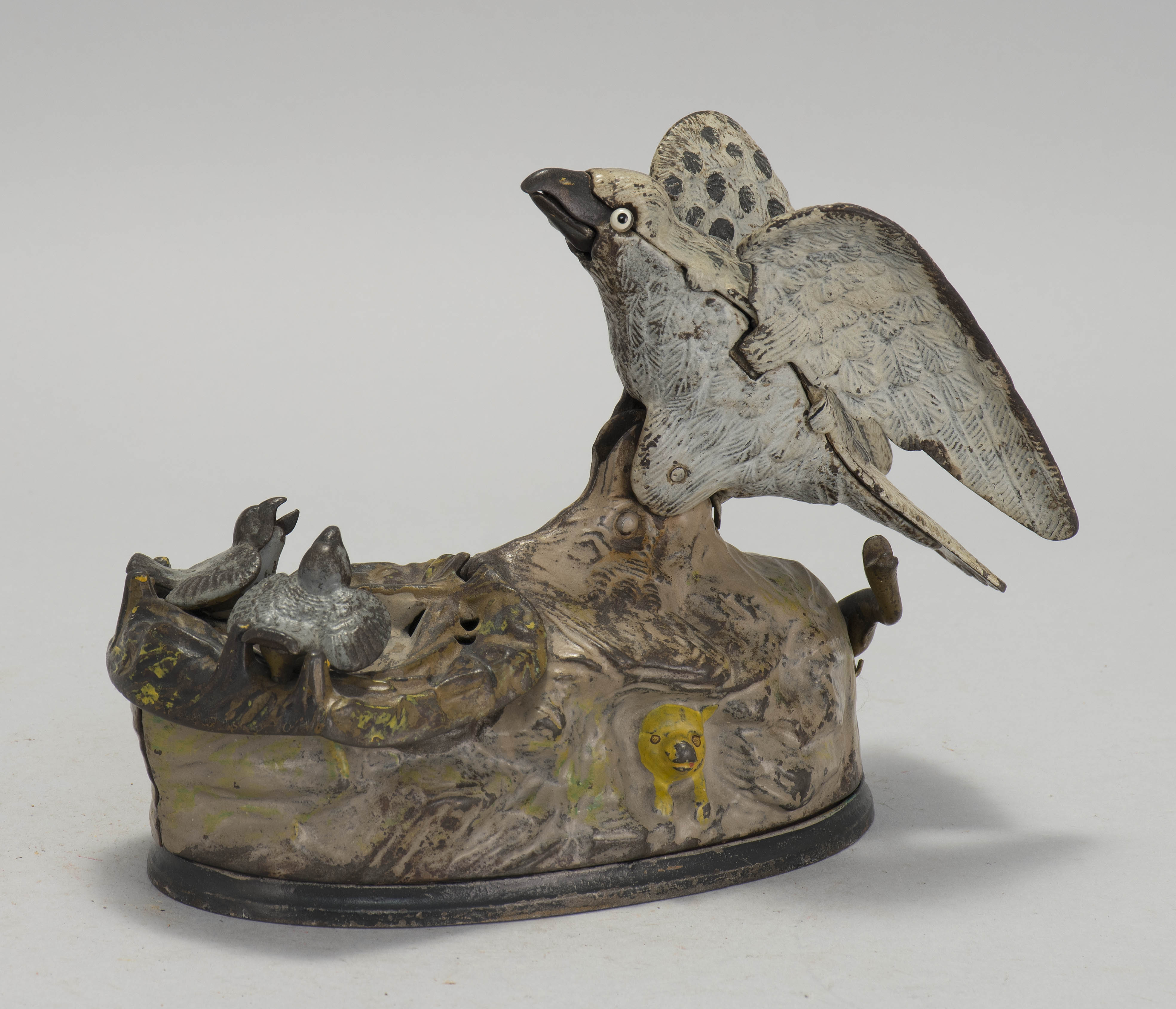 Appraisal: EAGLE AND EAGLETS CAST IRON MECHANICAL BANK Patented By J