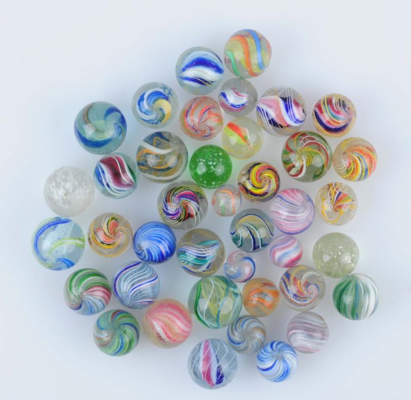 Appraisal: Lot Of Handmade Marbles Lot include multicolor onionskin micas swirls