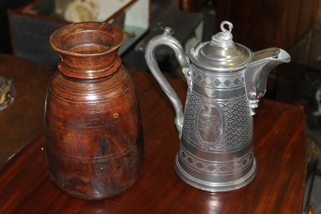 Appraisal: A TURNED WOOD VASE high and a Britannia metal lidded