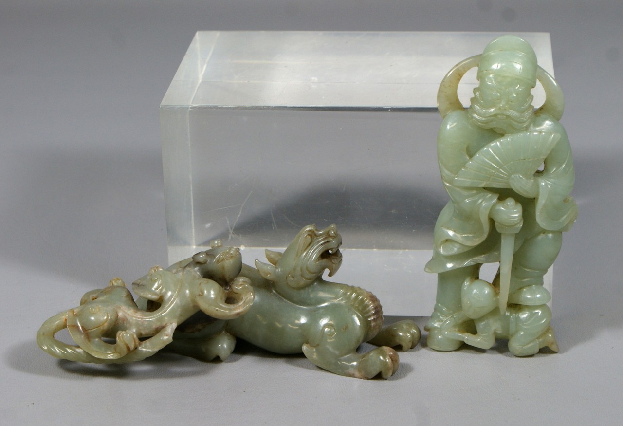 Appraisal: jade carvings man with fan h creature with young tail