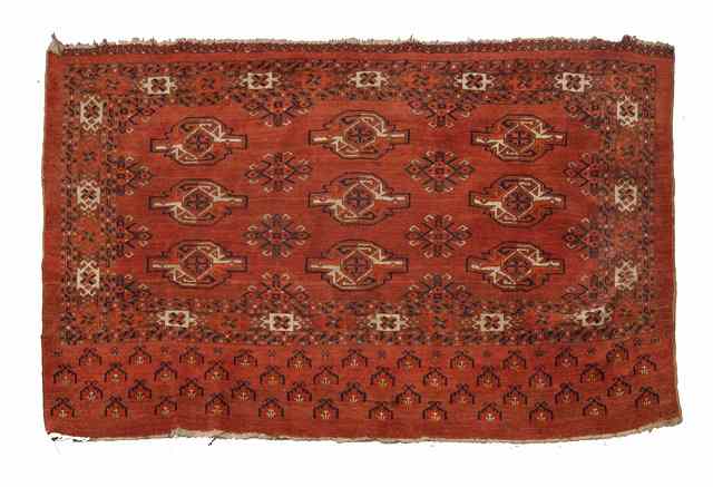 Appraisal: A TURKOMAN KIZIL AYAK JUVAL decorated three rows of guls