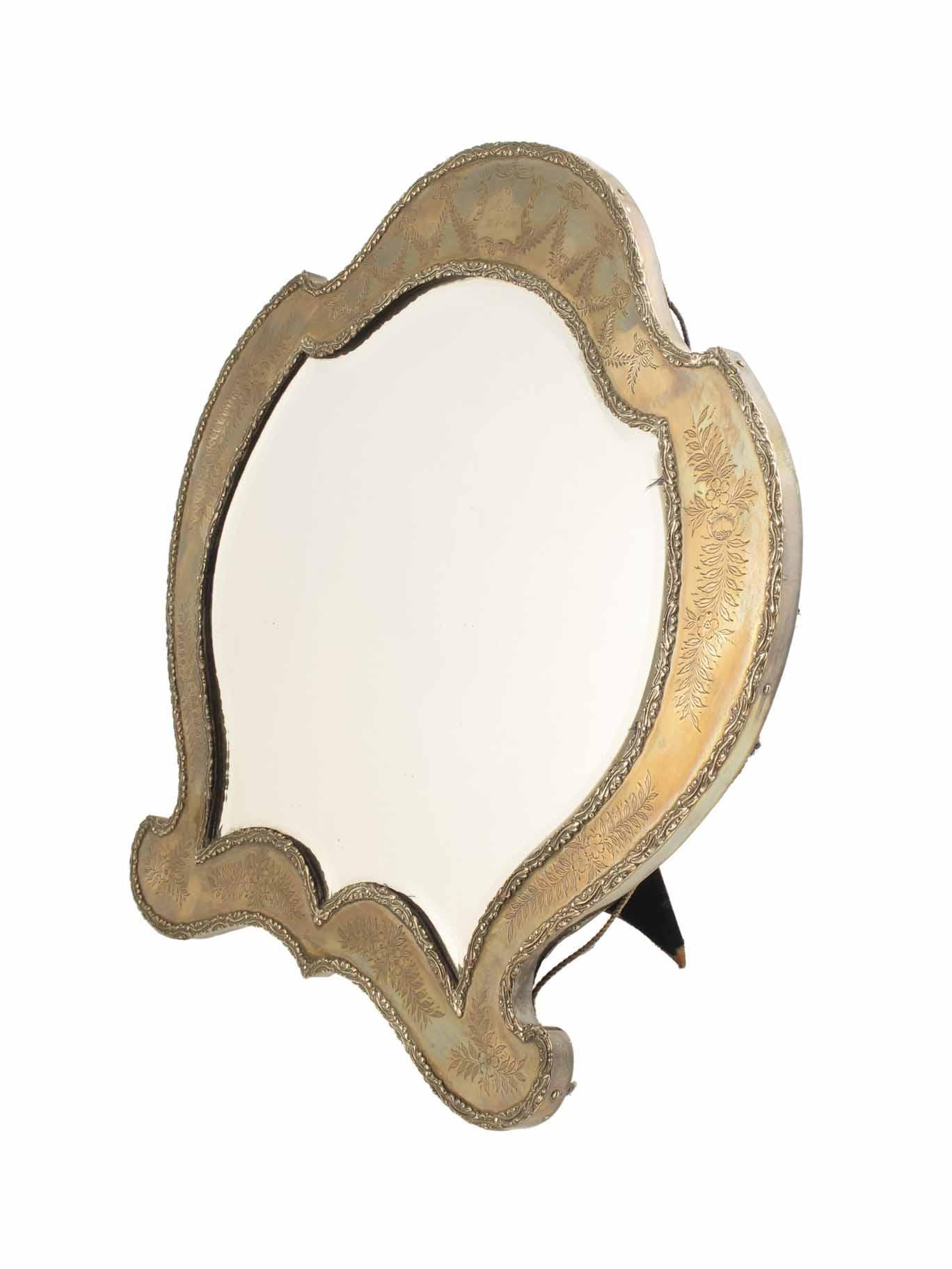 Appraisal: A silver cartouche shape easel back dressing table mirror