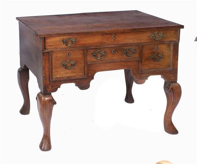 Appraisal: An antique mahogany side table or lowboy with one long