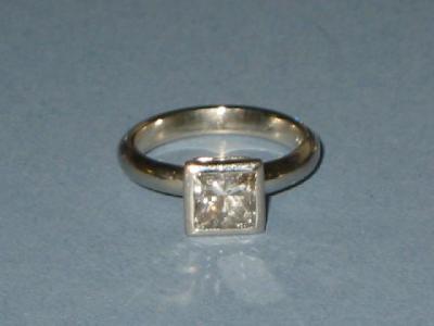 Appraisal: A SOLITAIRE DIAMOND RING the princess cut stone approximately cts