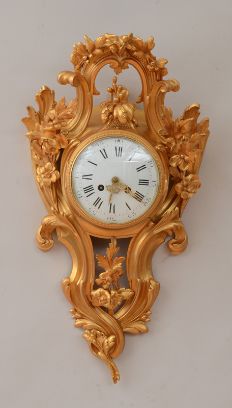 Appraisal: LOUIS XV STYLE GILT-BRONZE CARTEL CLOCK The in enamel dial