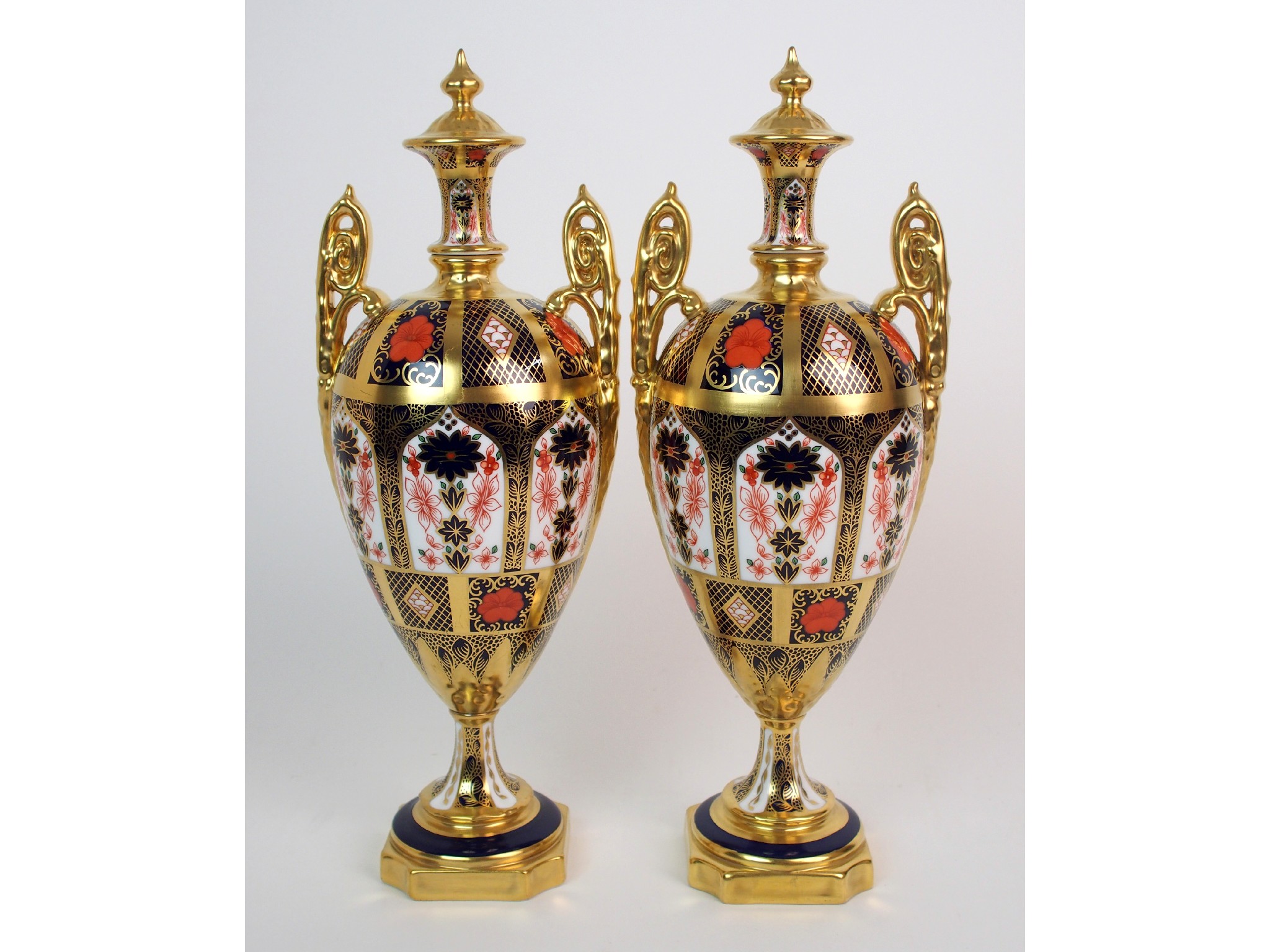 Appraisal: A pair of Royal Crown Derby Imari porcelain two-handled pedestal