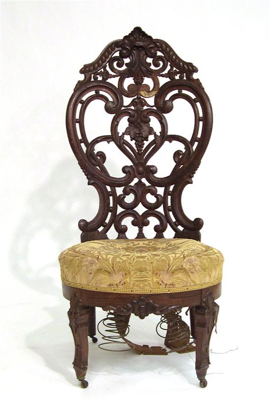 Appraisal: Victorian slipper chair with laminated back in a pierced scrollwork