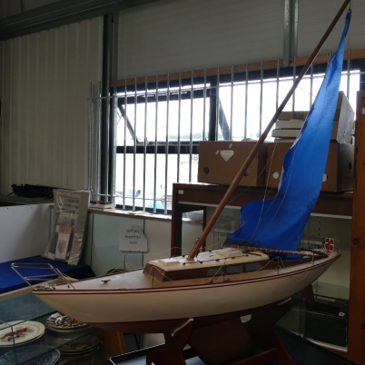 Appraisal: Model of yacht ''Optimist'' on stand resin metal with wood