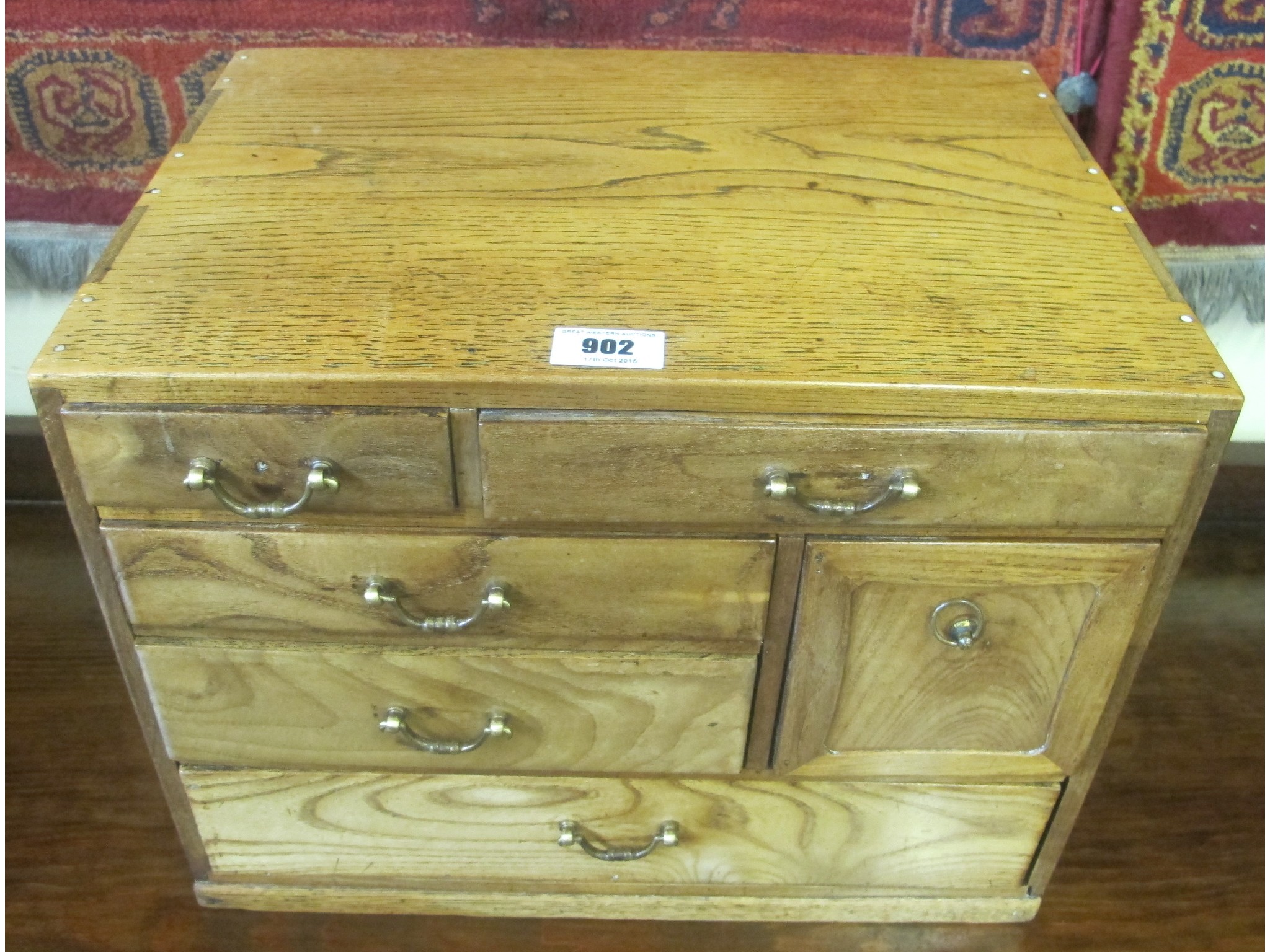 Appraisal: An oak six drawer collectors cabinet