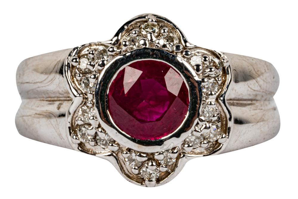 Appraisal: KARAT WHITE GOLD DIAMOND RUBY FLORAL RINGcentering one round cut