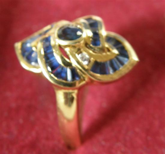 Appraisal: Sapphire and diamond set gold ring of knot design ct