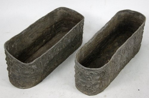 Appraisal: A pair of th Century oval lead jardini re embossed