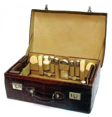 Appraisal: A GENTLEMAN'S VICTORIAN CROCODILE TOILET CASE the fitted interior holding