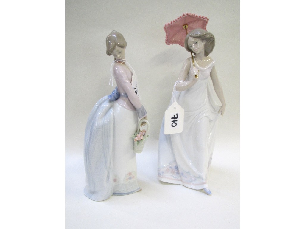 Appraisal: Two Lladro girls one holding an umbrella the other a