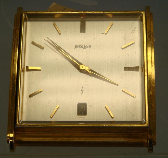 Appraisal: Swiss electro-mechanical desk clock with calendar window retailed by Neiman