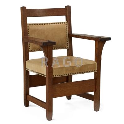 Appraisal: GUSTAV STICKLEY Armchair no Oak leather and brass tacks Red