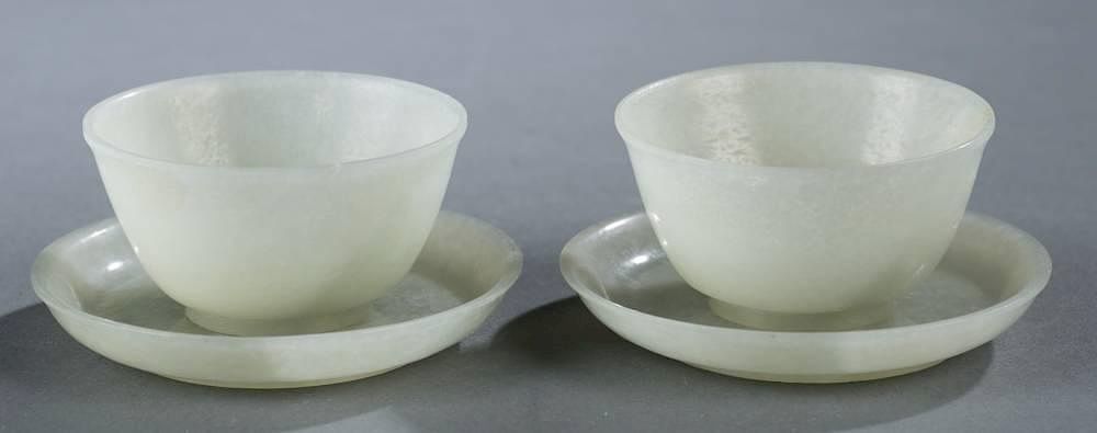 Appraisal: Pair of green jadeite wine cups saucers A pair of