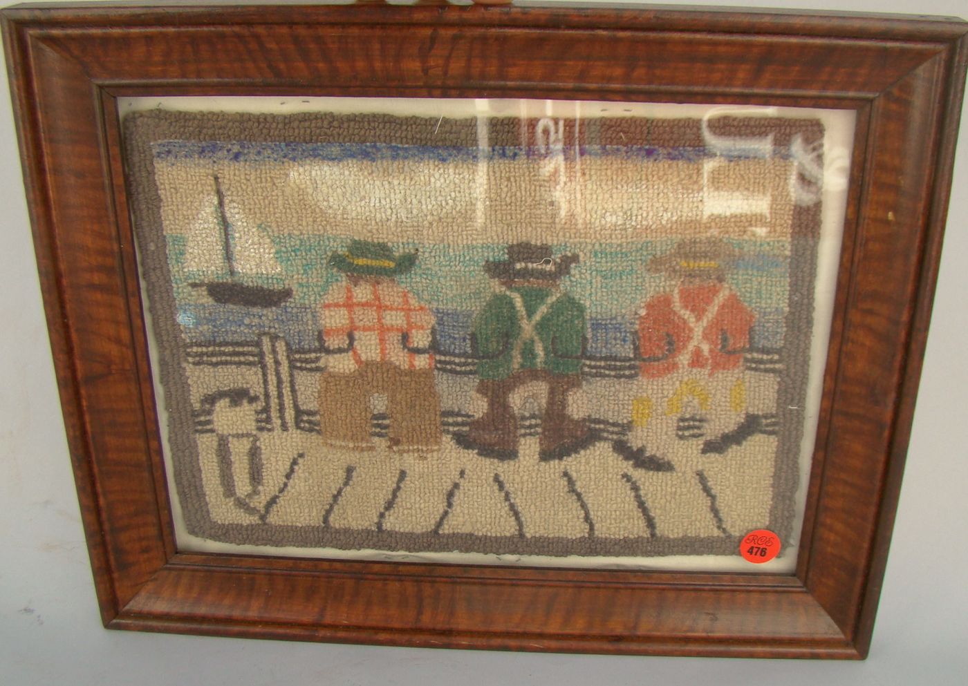 Appraisal: FRAMED GRENFELL-STYLE MAT Early th CenturyDepicting three sailors on a