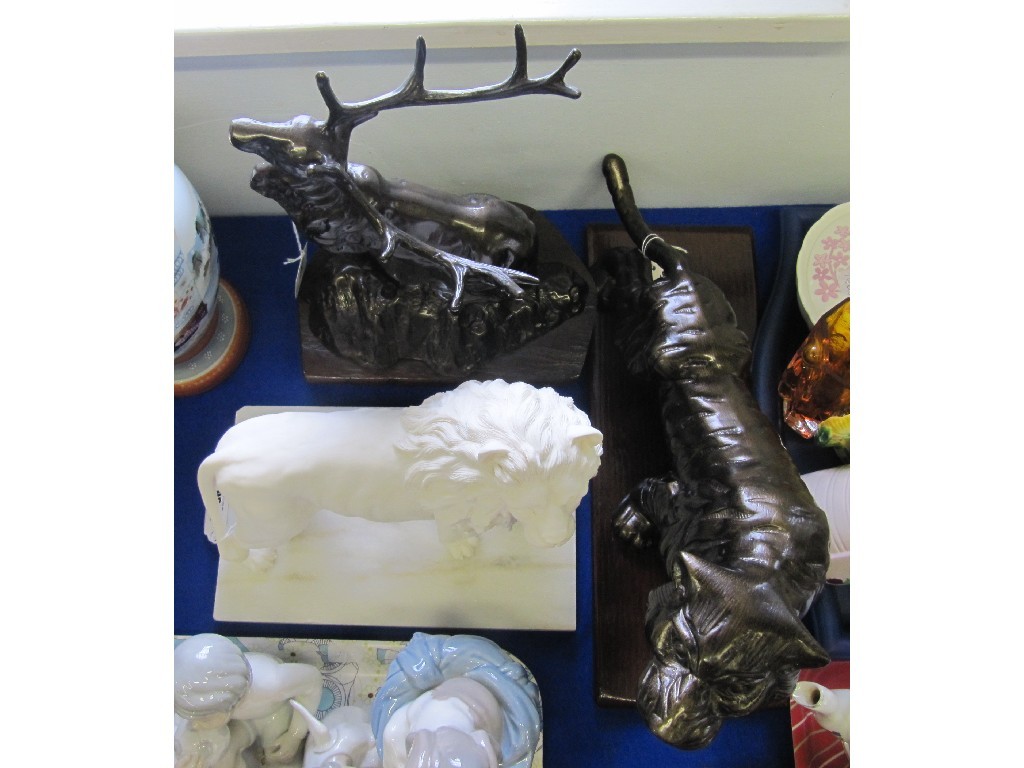 Appraisal: Three modern sculptures including a lion stag and tiger