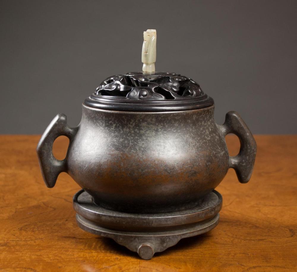 Appraisal: CHINESE BRONZE LIDDED CENSER of squat form with split handles