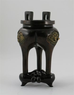 Appraisal: A Chinese bronze tripod censer cast with three panels of