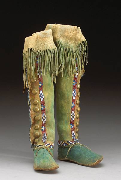 Appraisal: A pair of Kiowa beaded moccasins Covered in green-blue pigment