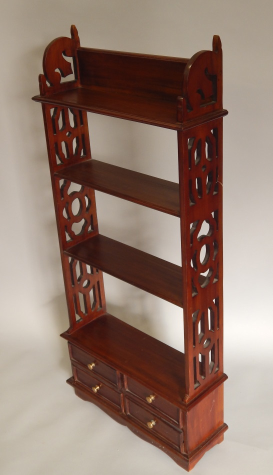 Appraisal: A reproduction hardwood wall shelf with fretwork sides and four