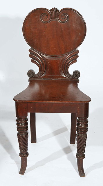 Appraisal: A TH CENTURY MAHOGANY HALL CHAIR with scroll back