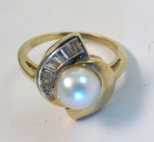 Appraisal: PEARL AND FOURTEEN KARAT GOLD RING centering a mm white