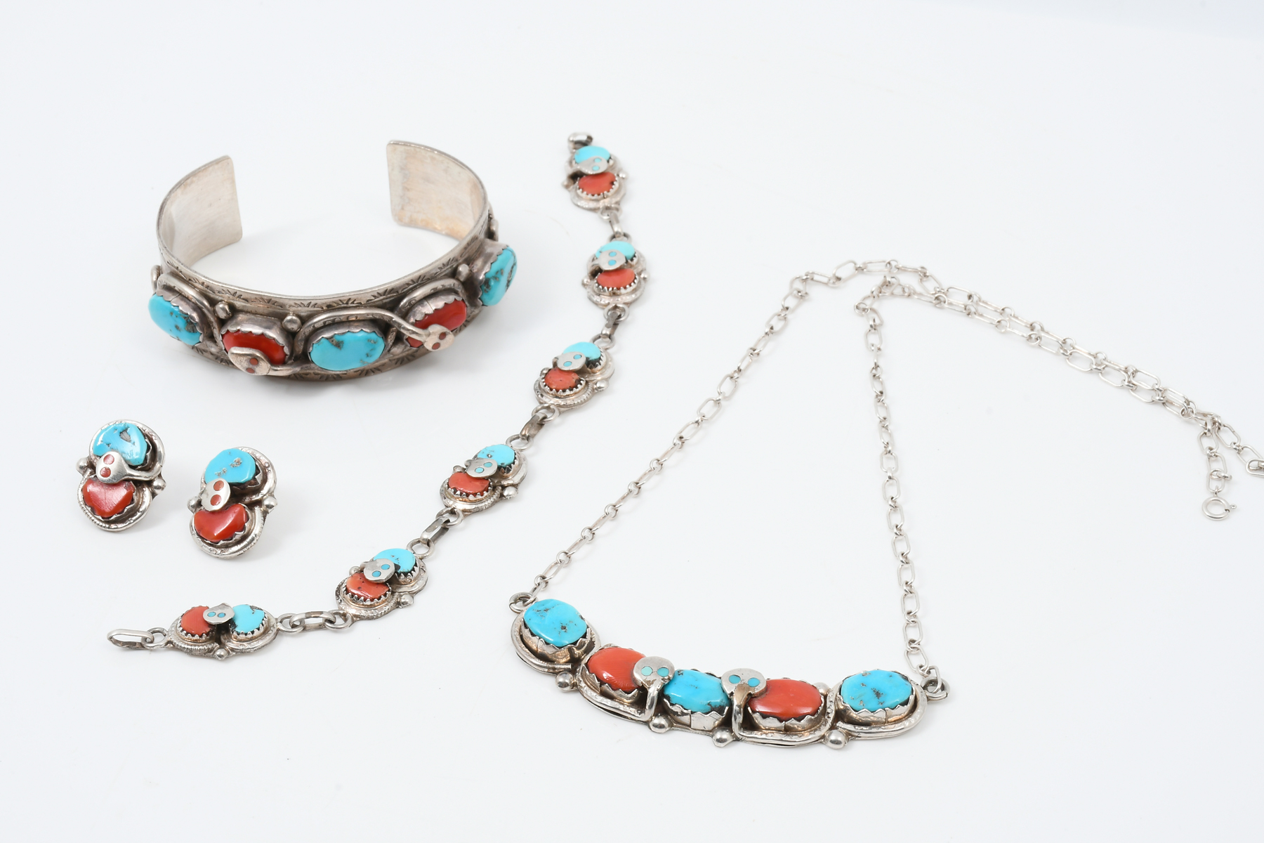 Appraisal: NATIVE AMERICAN STERLING TURQUOISE RED CORAL SUITE BY E CALAVAZA