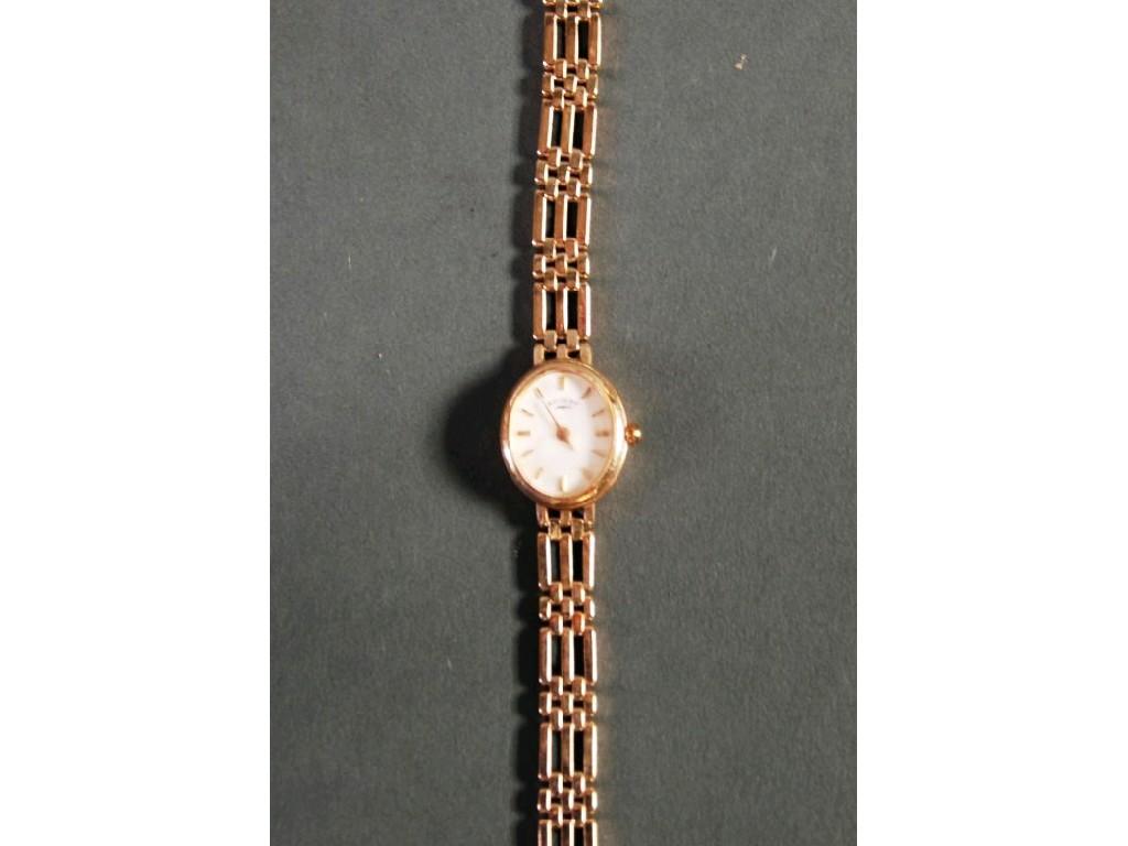 Appraisal: LADY'S ROTARY CT GOLD WRISTWATCH with white oval dial and