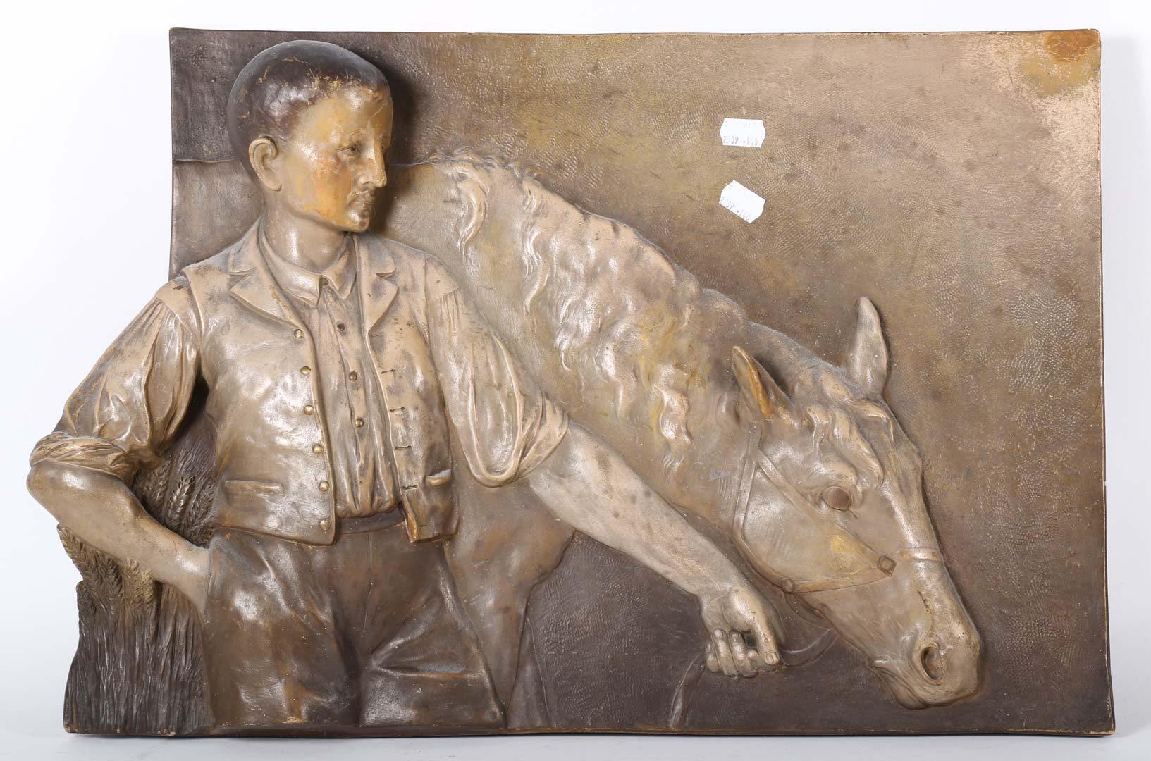 Appraisal: Ceramic plaque of a man and a horse Undernumber