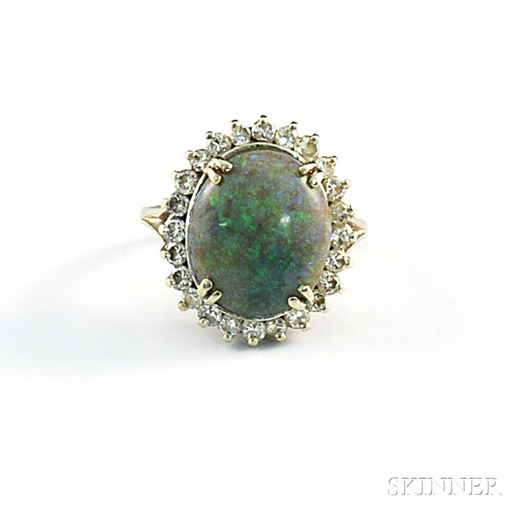 Appraisal: kt White Gold Opal and Diamond Ring the central prong-set