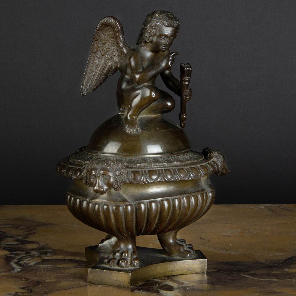 Appraisal: Continental Bronze Inkwell and Cover with Cupid Finial x in