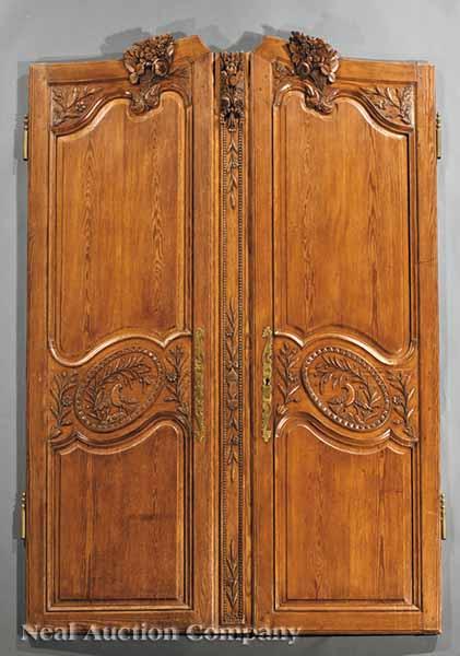 Appraisal: A Pair of Louis XVI Provincial Carved Pine Armoire Doors