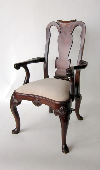 Appraisal: Georgian style mahogany child's armchairWith a scroll carved vasiform backrest