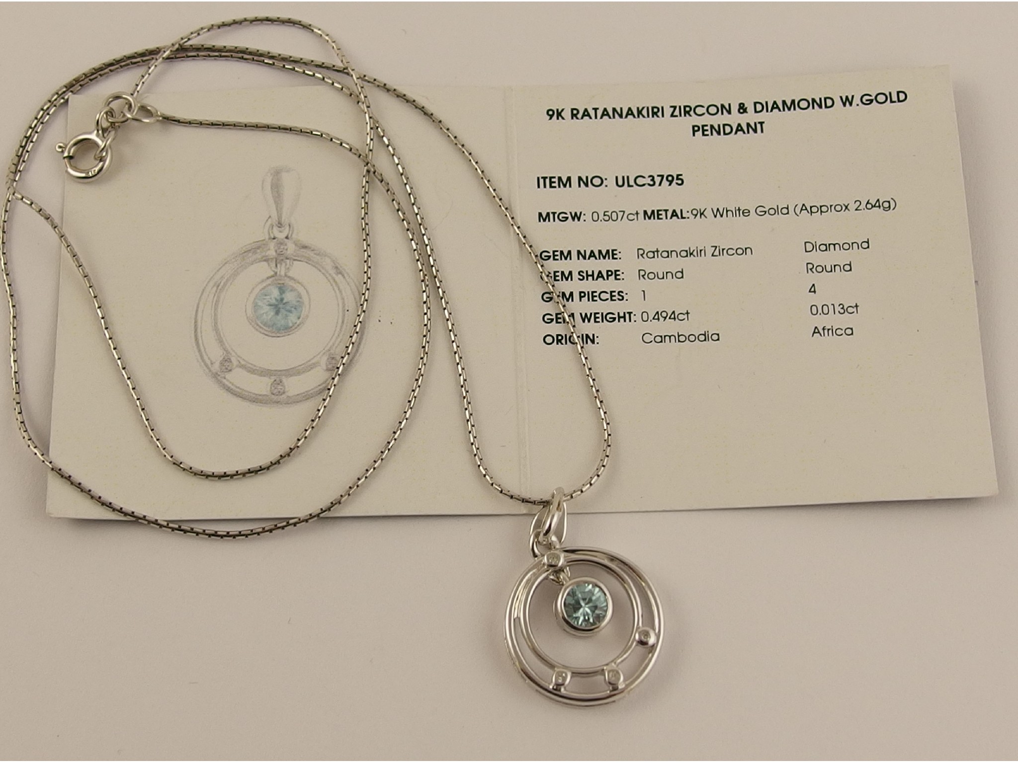 Appraisal: A ct white gold blue zircon and diamond pendant