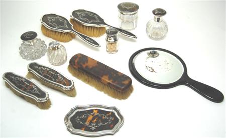 Appraisal: A large matched tortoiseshell and silver dressing table set various