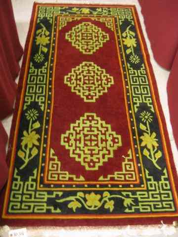 Appraisal: Chinese Handmade Sculptured Wool Rug geometrics florals deep red field