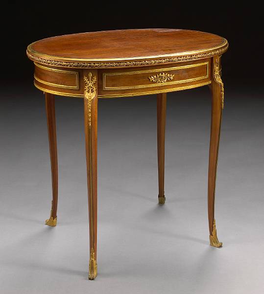 Appraisal: A Louis XV style gilt bronze mounted mahogany table Paul-Charles