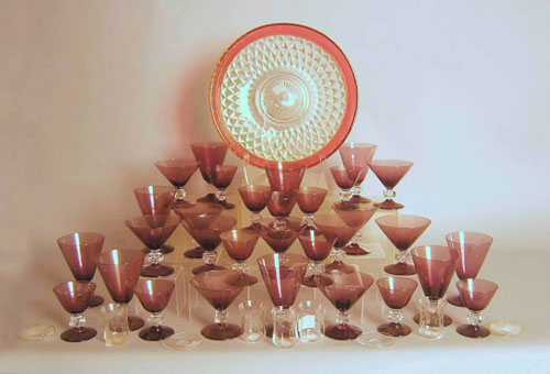 Appraisal: Large group of amethyst glass stemware together with miscellaneous stemware