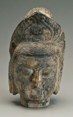 Appraisal: Chinese stone Buddha head dark gray carved with downcast eyes