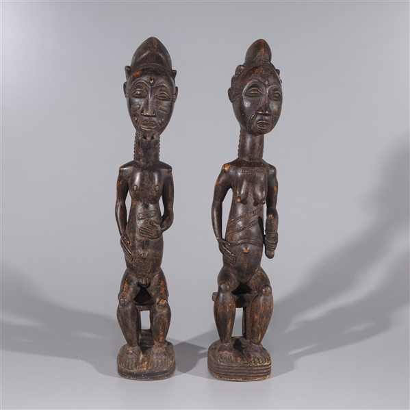 Appraisal: Pair of African carved wood fertility idols from the Ivory