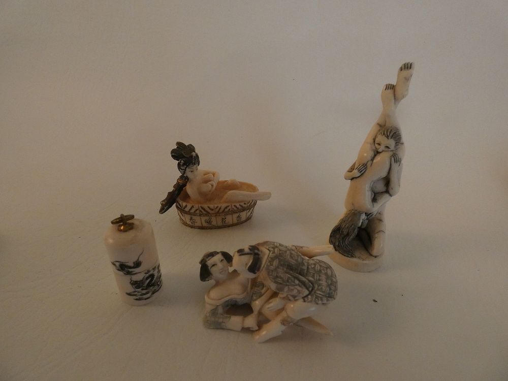 Appraisal: JAPANESE EROTIC NETSUKES Lot old Japanese erotic carved bone netsukes